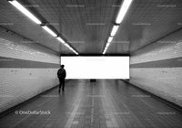 Underground Tunnel with Person Walking in Subway Station