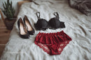 Chic Black Heels and a Red Lace Dress in a Cozy Bedroom Setting