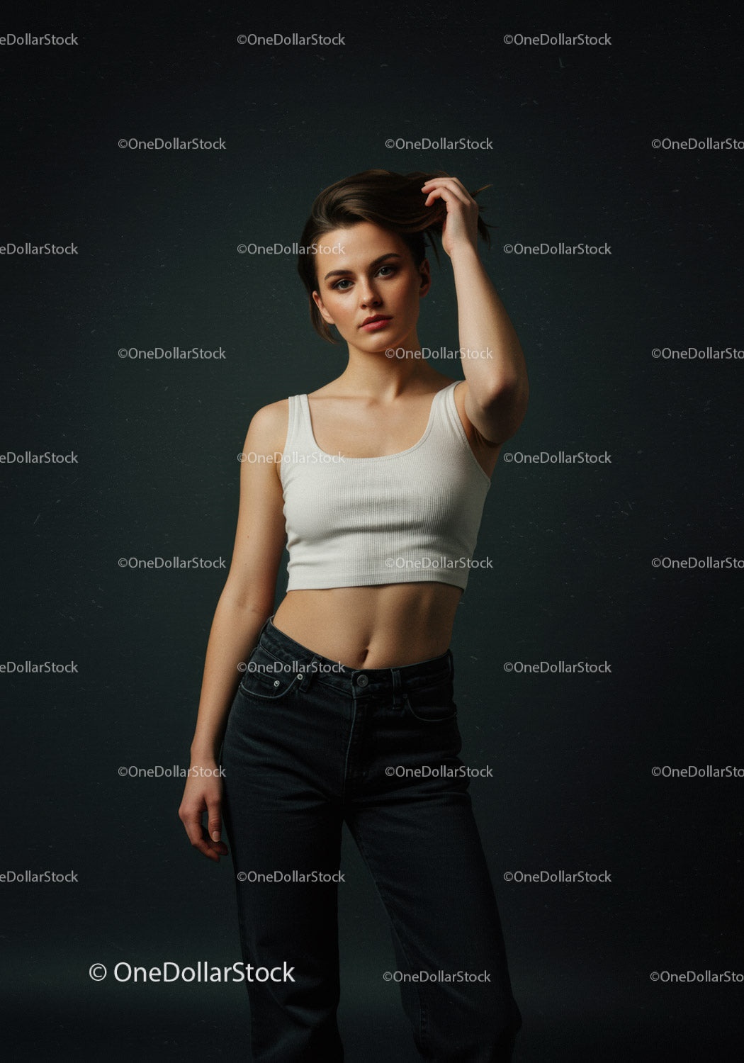 Young woman in white tank top posing confidently