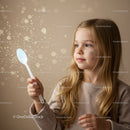 Little girl holding spoon with magical glowing sparkles