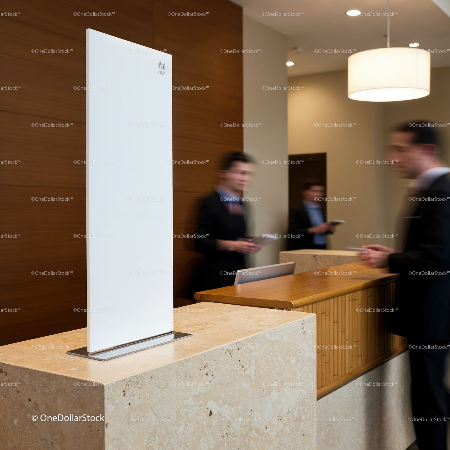 Modern hotel lobby with busy reception desk