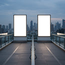Urban rooftop with glowing advertising billboards at dusk