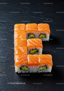 Fresh salmon avocado sushi arranged on black slate