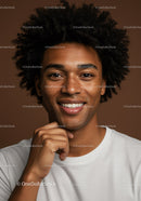 Portrait of a Smiling Young Man with Afro Hair in Casual Clothing