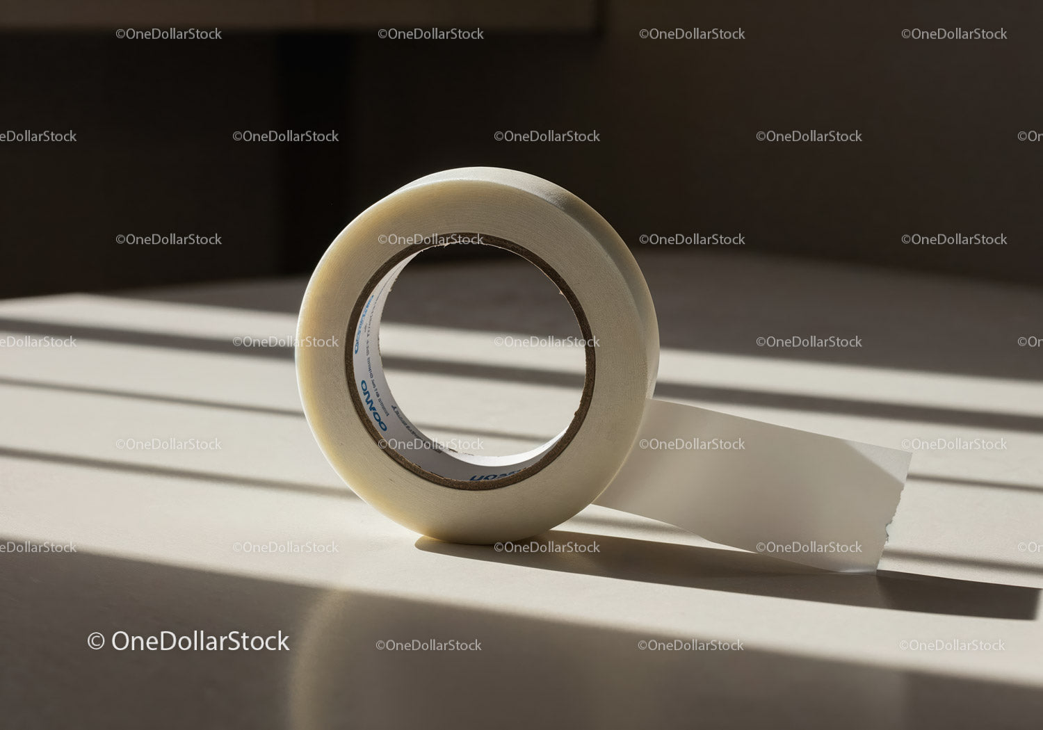 Clear adhesive tape casting soft shadows on surface