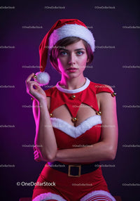 Young woman in festive Santa costume with playful pose