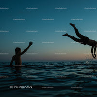 Playful Moments in the Water at Sunset