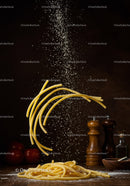 Fresh pasta noodles with falling flour in rustic kitchen
