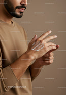 Close-Up of Man Applying Skincare Lotion to Hands for Healthy Skin