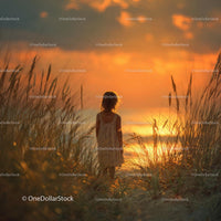Silhouette of a Child at Sunset by the Ocean Shore