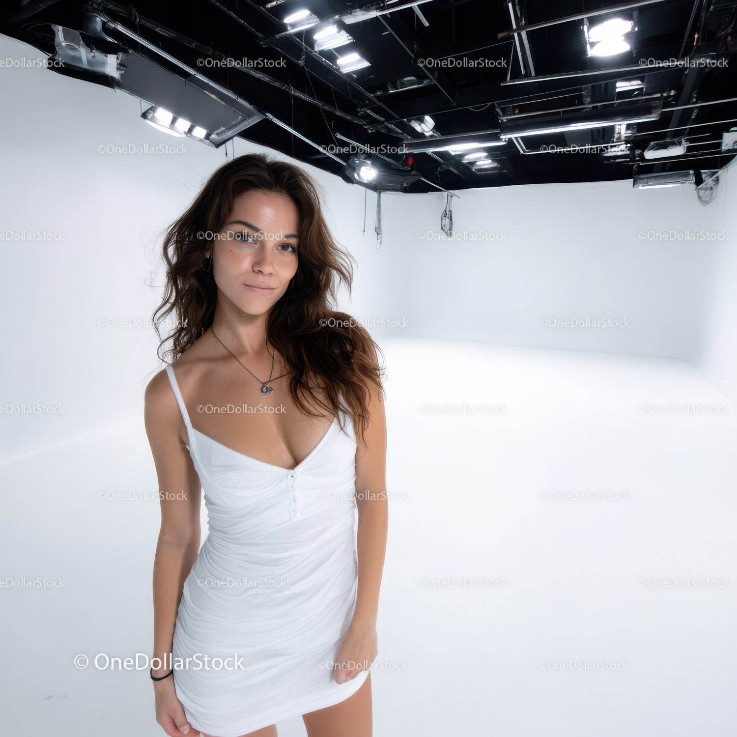 Elegant Woman in White Dress in Studio with Bright Lighting