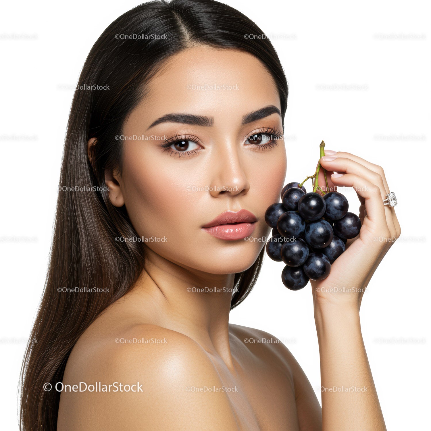 Portrait of a Woman Holding Black Grapes Featuring Youthful Beauty and Elegance