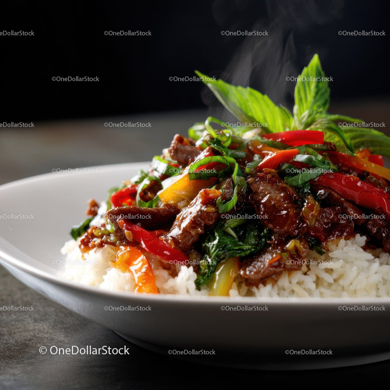 Colorful Beef and Vegetable Stir-Fry Over Steaming Rice