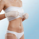 Stylish Woman in Bandage Top and Medical Gloves in Bright Studio