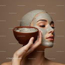 Woman Applying Clay Facial Mask for Skin Rejuvenation