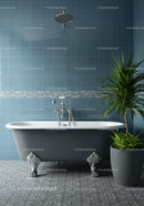 Elegant clawfoot bathtub in modern blue tiled bathroom