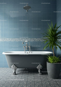 Elegant clawfoot bathtub in modern blue tiled bathroom