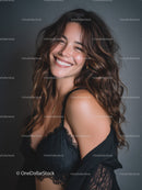 Joyful Woman with Curly Hair Smiling in Studio Portrait