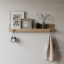 Decorative Wooden Shelf with Vases and Art Prints in Modern Interior