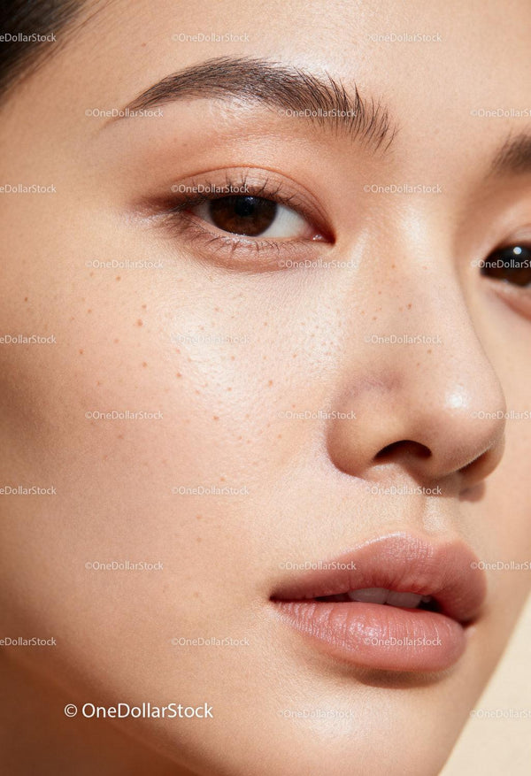 Close-up of natural skin texture with freckles