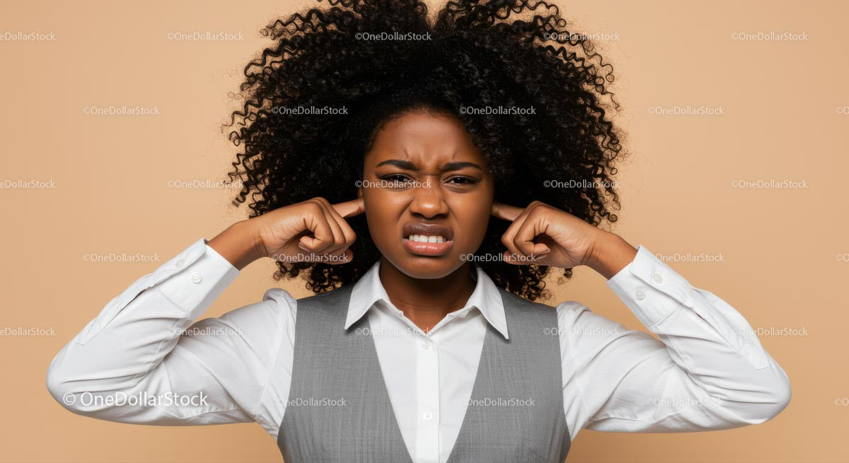 Frustrated Woman Covering Ears with Earplugs Showing Stress and Displeasure