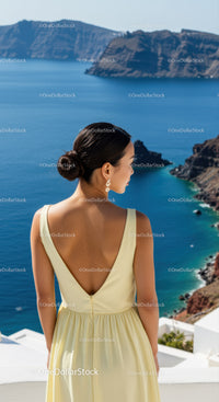 Woman in Yellow Dress Enjoying Scenic Ocean View