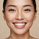 Close-up of smiling young woman with smooth skin