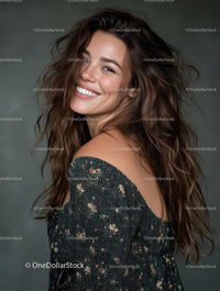Joyful Young Woman with Long Brown Hair Smiling in Studio Portrait