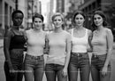 Diverse group of young women standing united outdoors