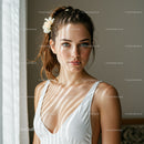 Portrait of a Young Woman with Red Hair and Blue Eyes Wearing a White Dress