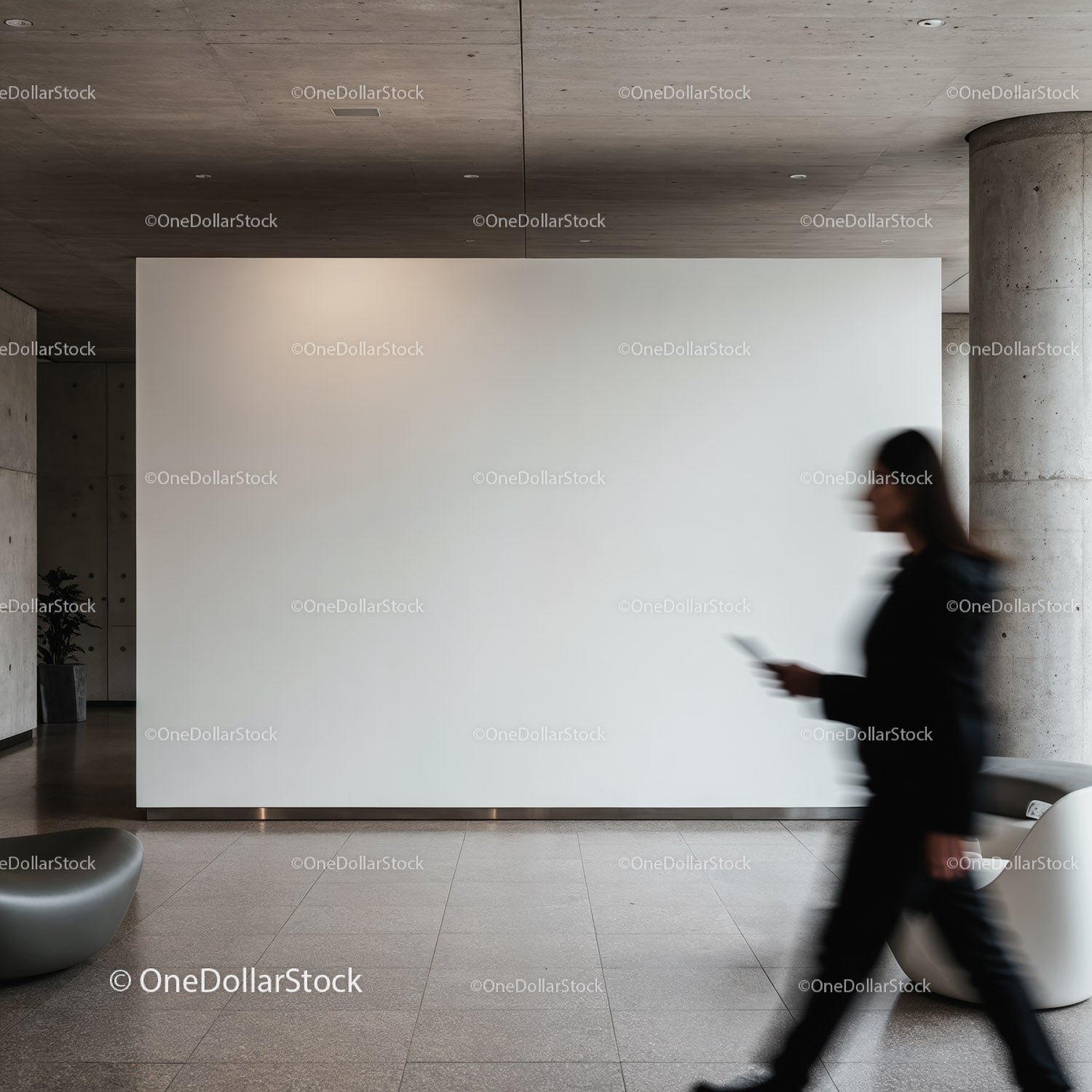 Blurred woman walking past blank modern gallery wall