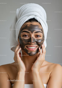 Woman with Black Facial Mask Enjoying Skincare Routine in Spa Setting