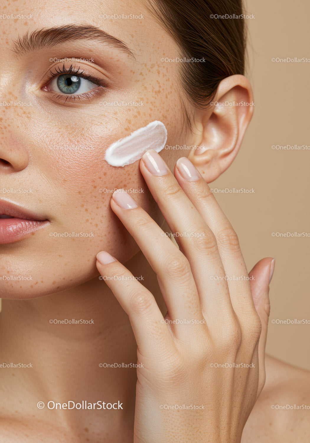 Close-up of woman applying face cream for skincare routine