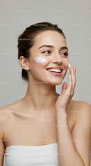 Young Woman Applying Skin Moisturizer with a Bright Smile