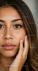 Close-Up of Confident Woman with Brown Eyes and Natural Makeup