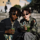 Two Trendy Women with Iced Drinks in Stylish Urban Outing