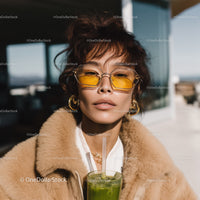 Fashionable Woman Wearing Yellow Sunglasses in Urban Setting