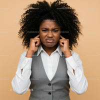 Frustrated Woman Covering Ears Expressing Annoyance Indoor