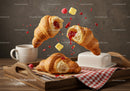 Fresh croissants with raspberry jam and butter on tray
