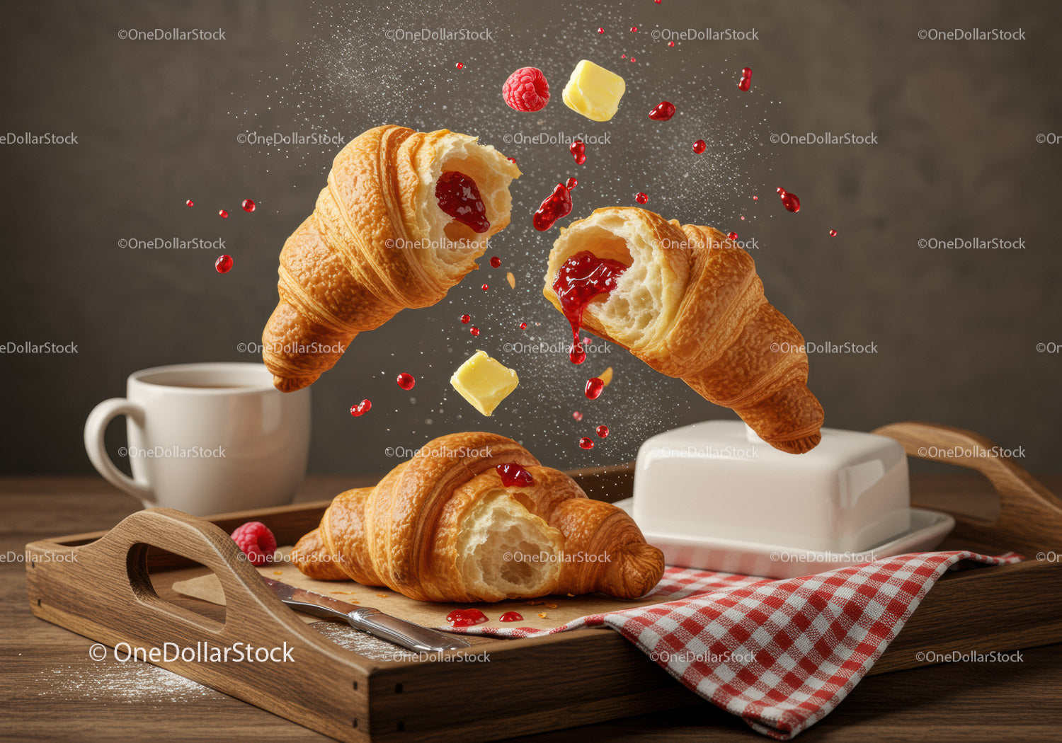 Fresh croissants with raspberry jam and butter on tray