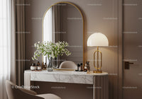Elegant vanity with marble top and golden arched mirror