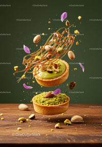 Pistachio tarts with caramel and scattered nuts closeup