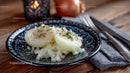 Deviled Eggs on a Decorative Plate with Onions and Rustic Setting