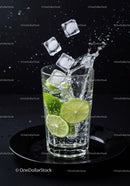 Refreshing lime slices splash in sparkling water glass