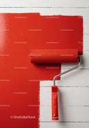 Red Paint and Roller on White Wooden Surface for Interior Renovation