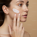 Close-up of Woman Applying Face Cream with Natural Skin and Makeup