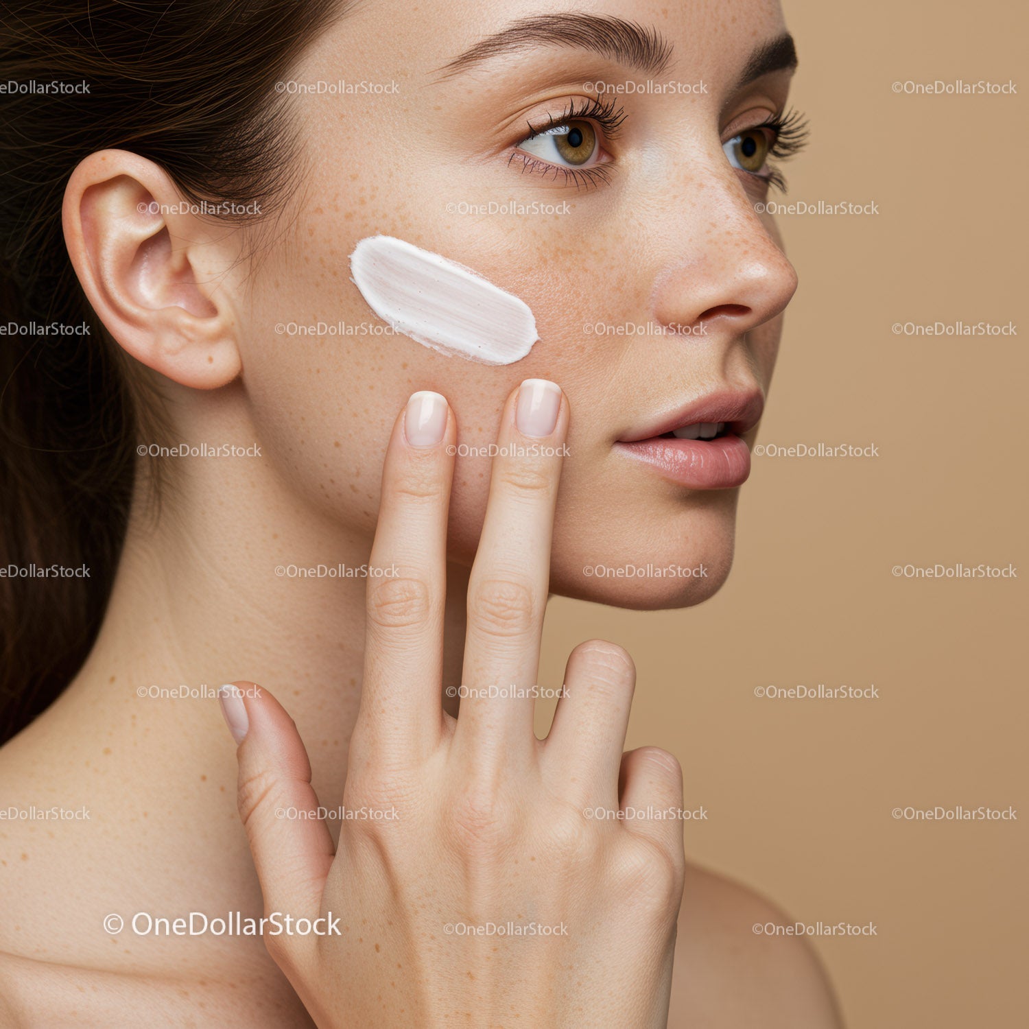 Close-up of Woman Applying Face Cream with Natural Skin and Makeup