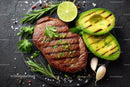 Gourmet Grilled Steak with Sliced Avocado and Fresh Herbs
