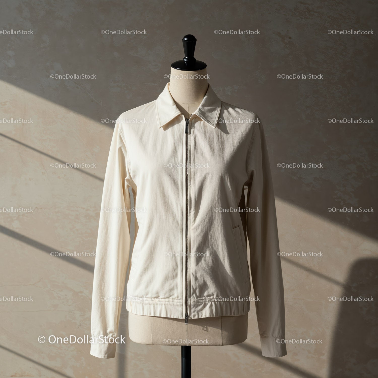Minimalist white jacket on tailor mannequin indoors