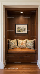 Elegant Wooden Nook with Decorative Cushions and Framed Landscape Art